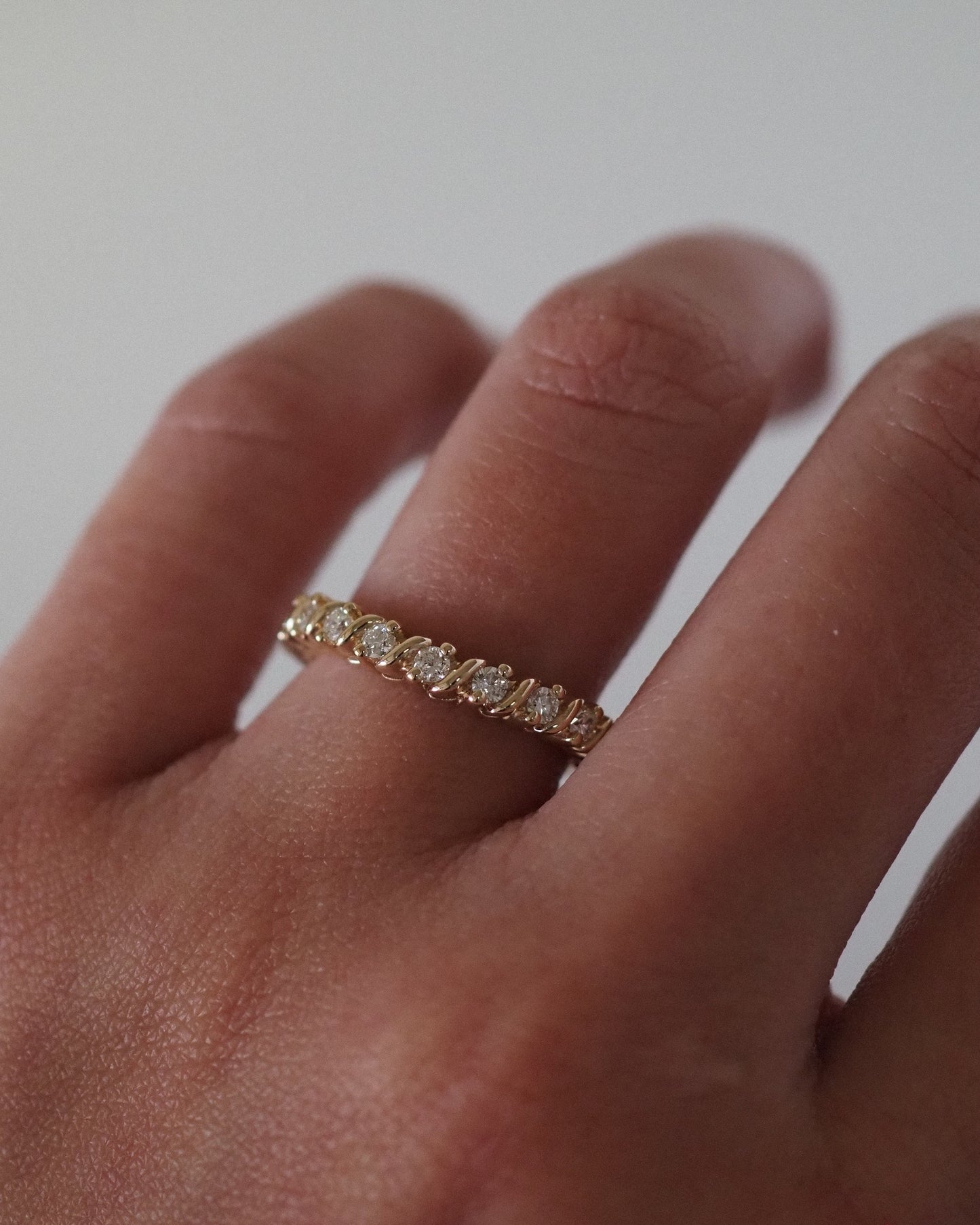 0.13 TCW Round Twisted Moissanite Wedding Band