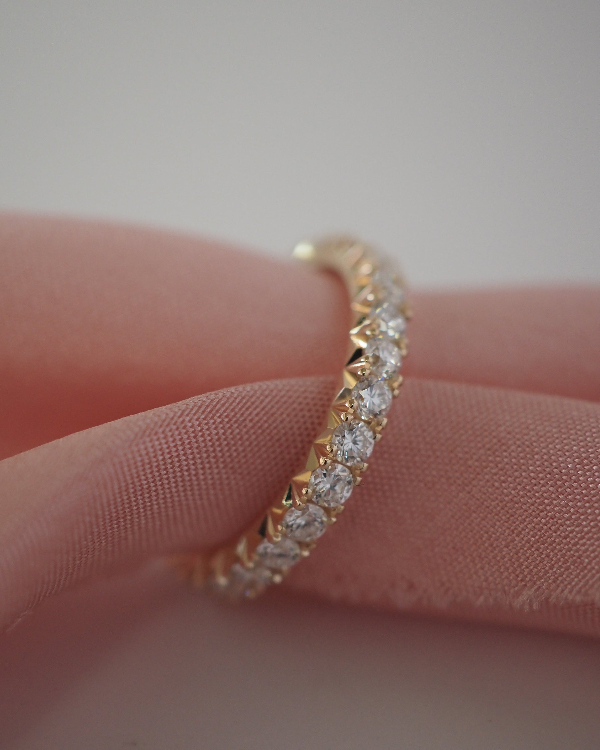 0.13 TCW Round Twisted Moissanite Wedding Band