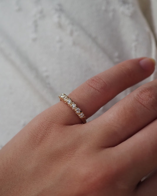 0.13 TCW Round Twisted Moissanite Wedding Band