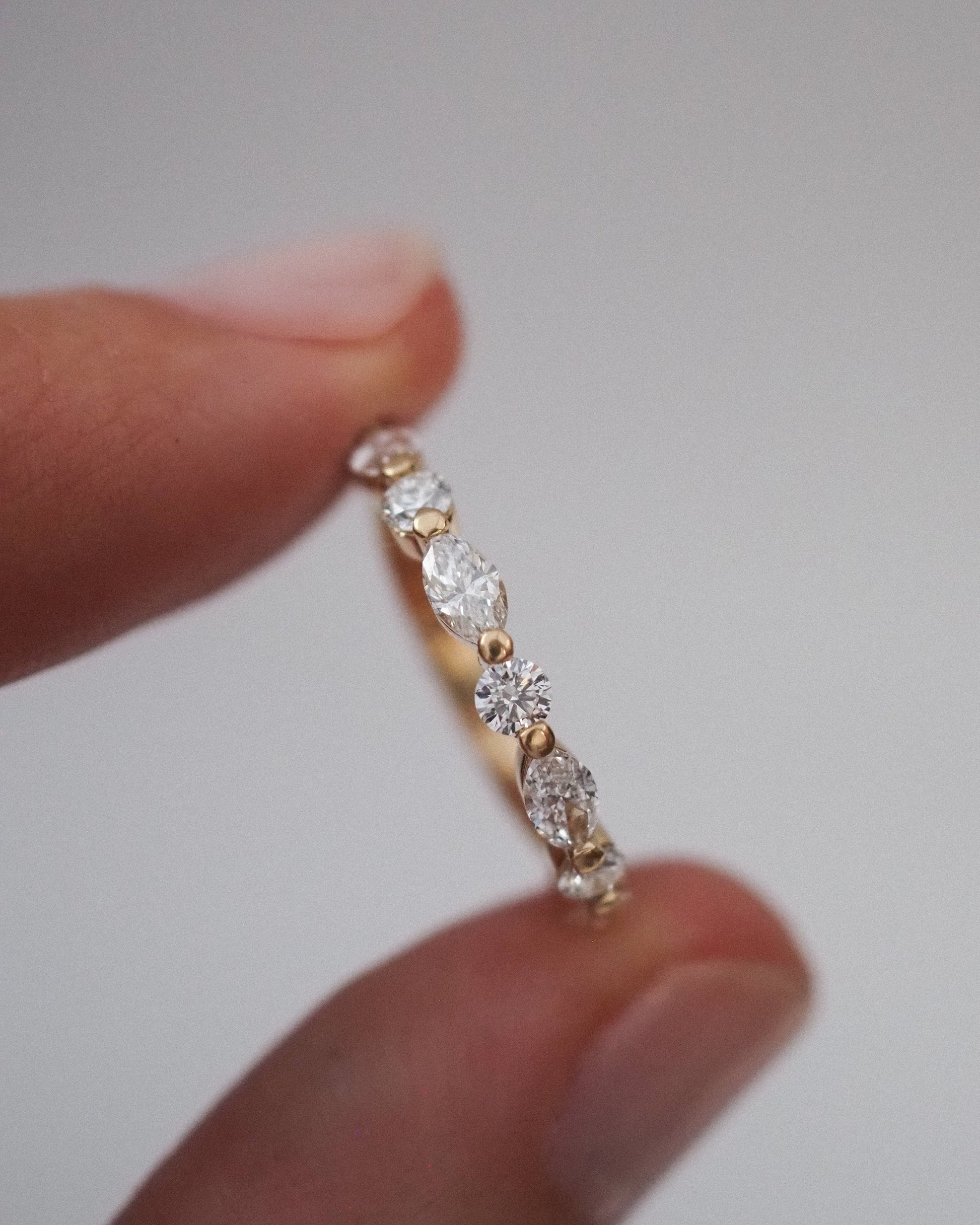 0.13 TCW Round Twisted Moissanite Wedding Band